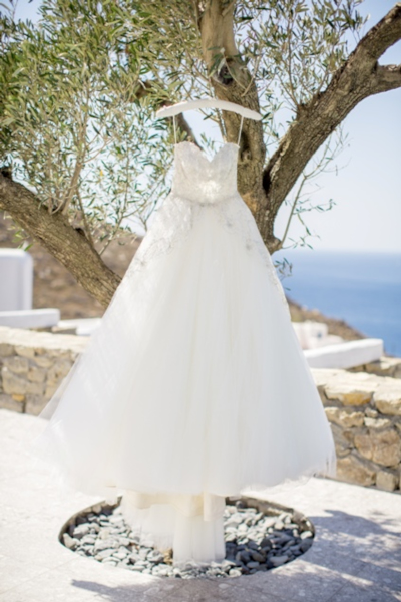 Capturing the elegance of a wedding dress in Greece's picturesque setting at this dream destination wedding in Mykonos.